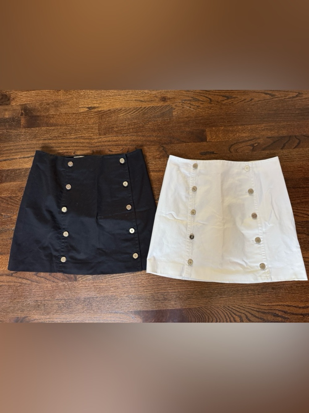 2 Michael Kors lined button down closure skirts. Black and white. Size 12.